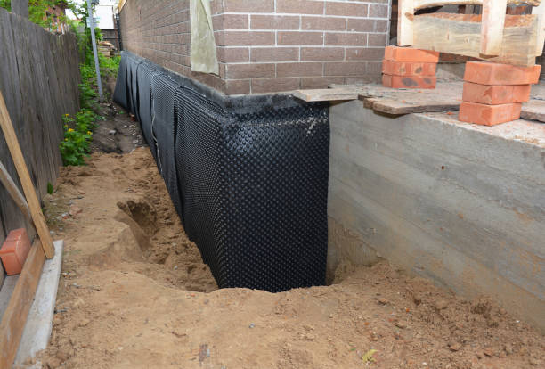 Happy homeowners after waterproofing job in Madison Heights